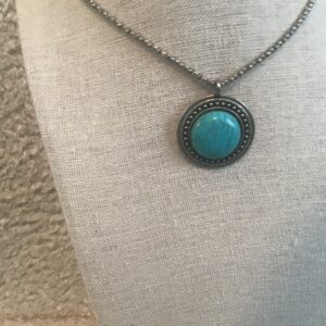 Circular Turquoise and Silver colored necklace