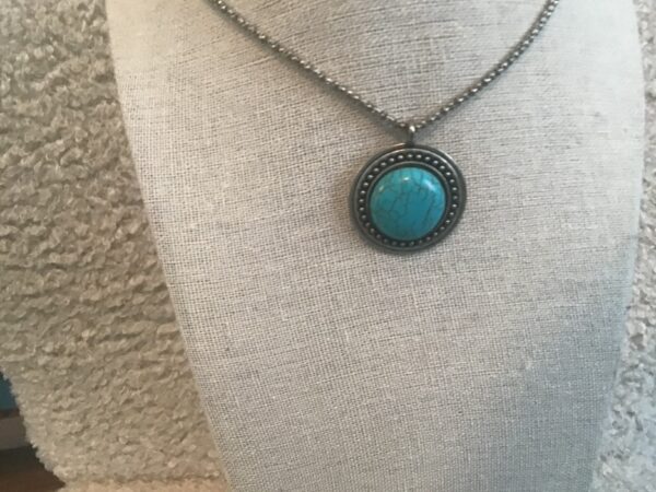 Circular Turquoise and Silver colored necklace