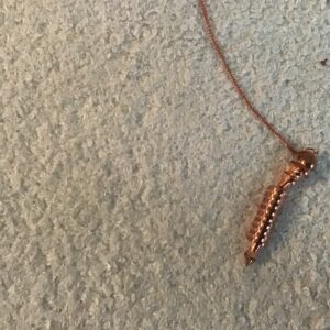 Rose Gold Colored Metal Chamber Pendulum